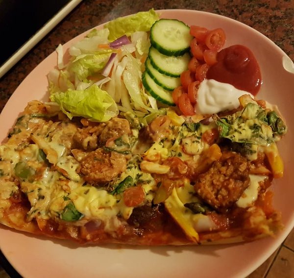 Thin crust homemade pizza and salad