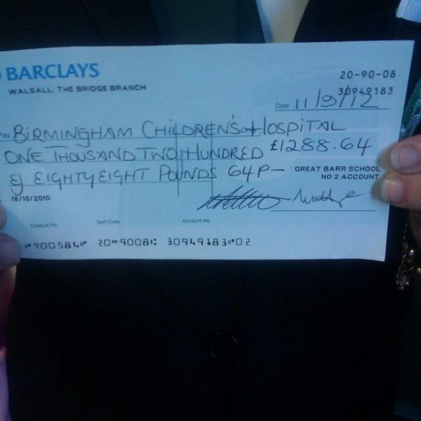 The cheque from the money we raised for the Birmingham Childrens Hospital